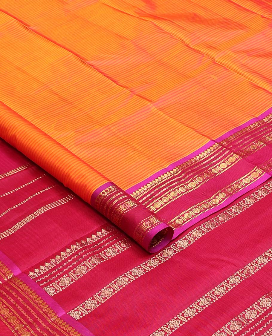 Orange striped and buttas Kanchipuram silk saree, contrast border and pallu of thilakam mokku, muthu, neli, and rudraksham designs