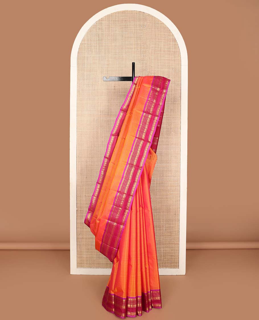 Orange striped and buttas Kanchipuram silk saree, contrast border and pallu of thilakam mokku, muthu, neli, and rudraksham designs