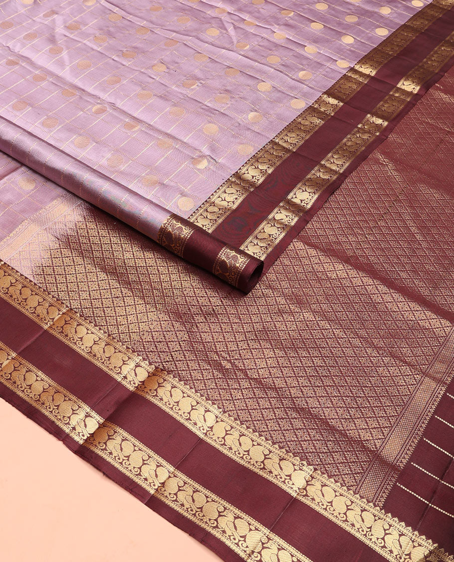 Lavender rudraksham butta enclosed checked soft silk saree, contrast rettai pettu border of rekku, muthu, banaras, and mayil designs, and jaal pallu