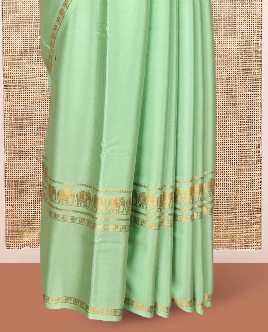 Green Plain Mysore Silk Saree, Highlighted by Traditional Zari Border of Elephant Motifs, Subtly Zari Striped Pallu, and Paired with a Matching Blouse