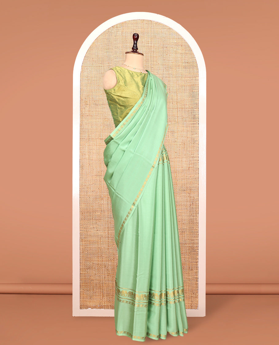 Green Plain Mysore Silk Saree, Highlighted by Traditional Zari Border of Elephant Motifs, Subtly Zari Striped Pallu, and Paired with a Matching Blouse