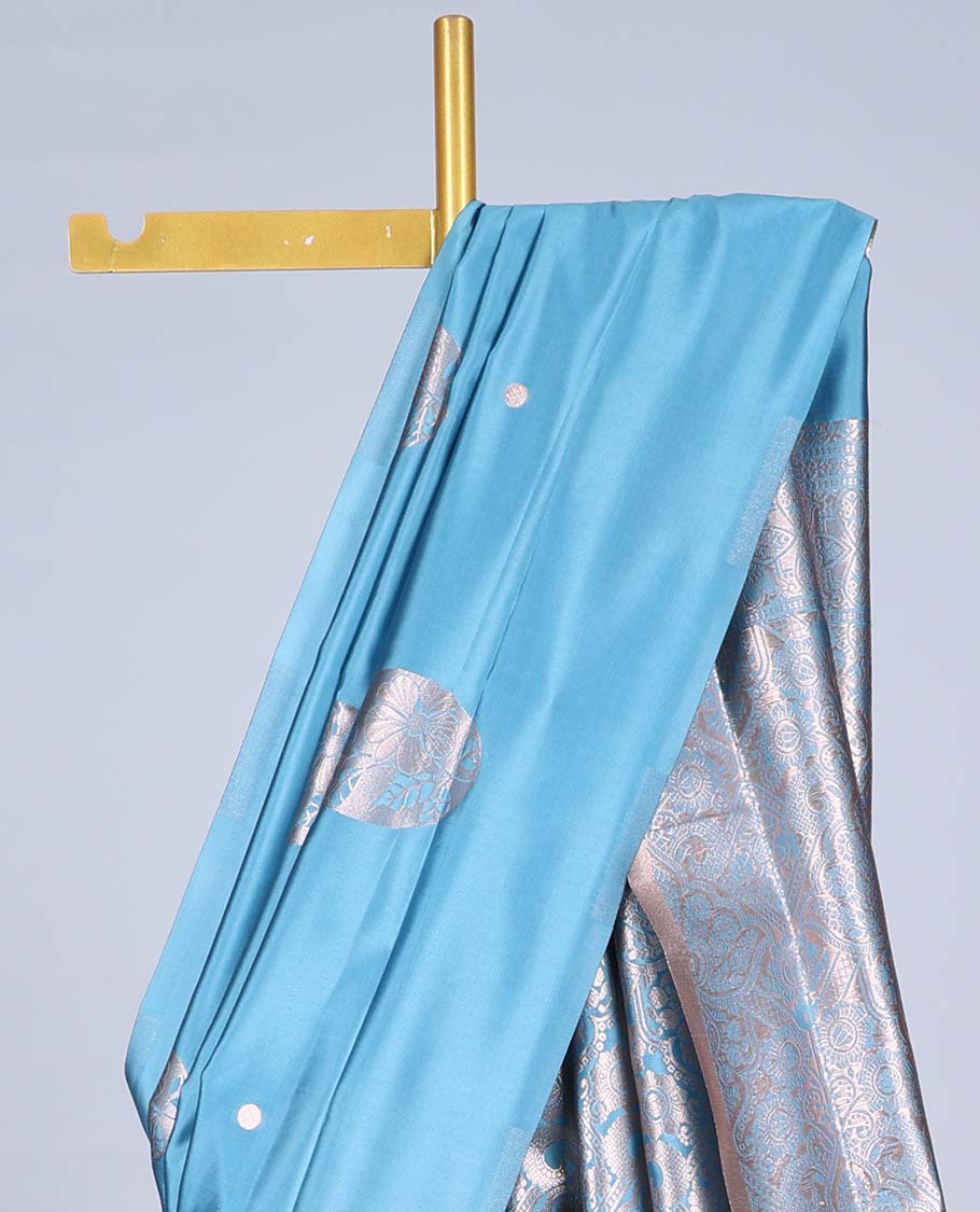 Borderless blue butter silk saree with zari buttas, zari-rich intricately designed pallu