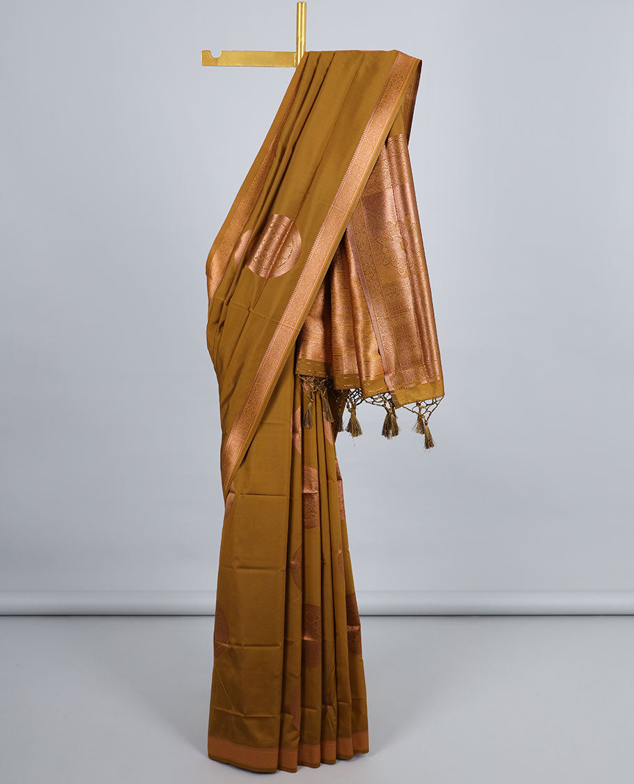 Dark mustard butter silk saree with chakram zari buttas, zari border & self-pallu of traditional designs