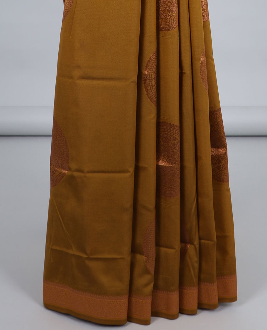 Dark mustard butter silk saree with chakram zari buttas, zari border & self-pallu of traditional designs