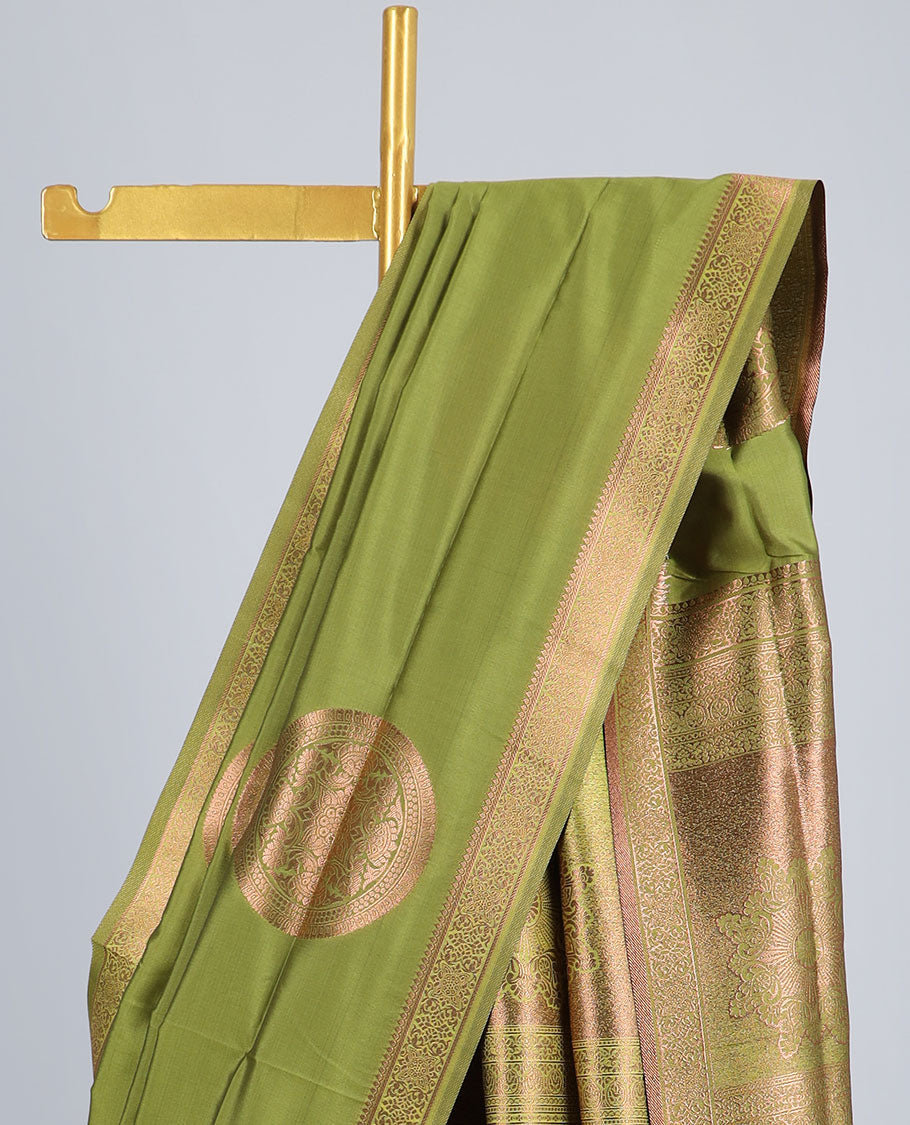 Green butter silk saree with chakram zari buttas, zari border & self-pallu of traditional designs