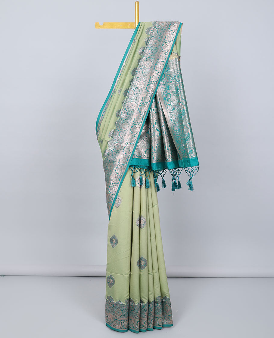 Green butter silk saree with zari buttas, contrast zari border of paisley & floral creeper & intricate pallu