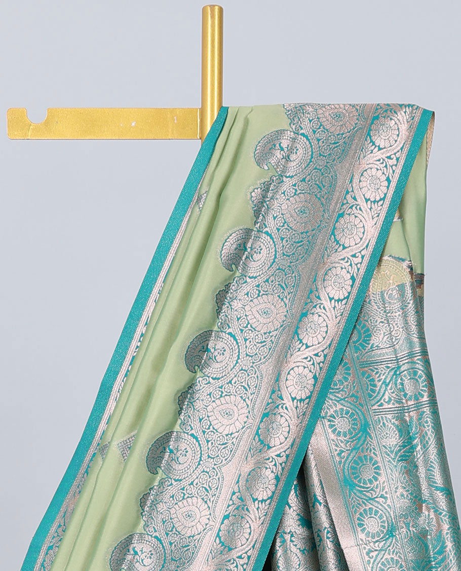 Green butter silk saree with zari buttas, contrast zari border of paisley & floral creeper & intricate pallu