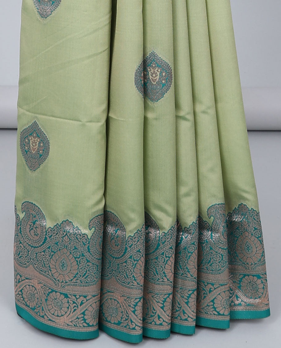 Green butter silk saree with zari buttas, contrast zari border of paisley & floral creeper & intricate pallu