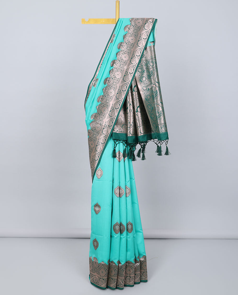 Turquoise butter silk saree with zari buttas, contrast zari border of paisley & floral creeper & intricate pallu
