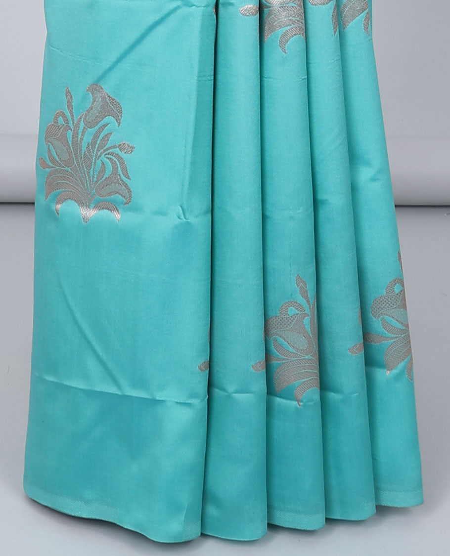 Borderless blue butter silk saree with zari buttas, contrast pallu of intricate designs in zari
