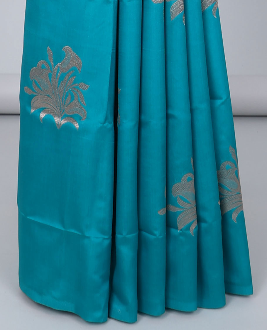 Borderless blue butter silk saree with zari buttas, contrast pallu of intricate designs in zari