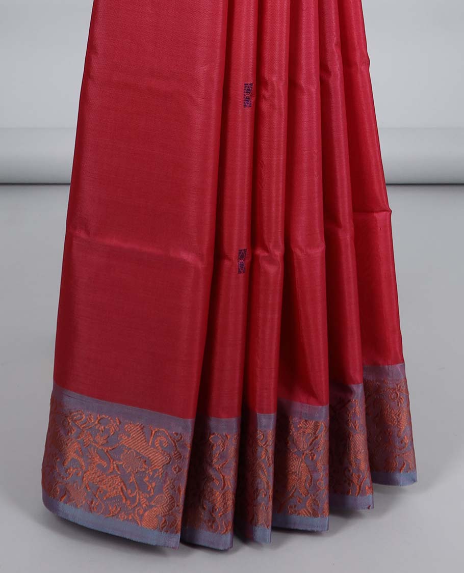 Maroon banana pith saree with buttas, contrast animal motifs border & pallu of stripes