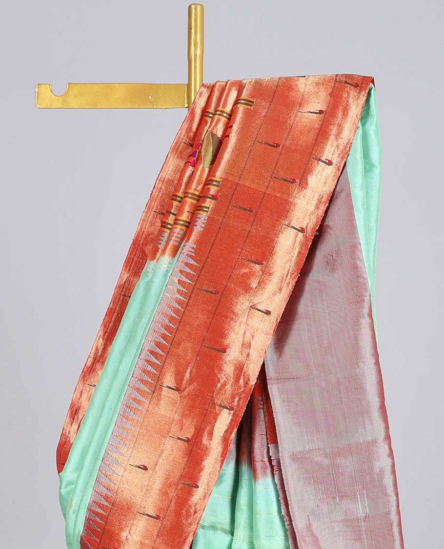 Green paithani silk saree with zari buttas, contrast vidarbha triple muniya border & pallu of colorful floral designs