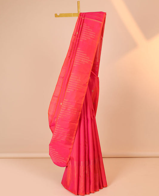Pink silk saree with mayil chakram buttas, zari border of temple designs & zari-rich pallu of zari stripes