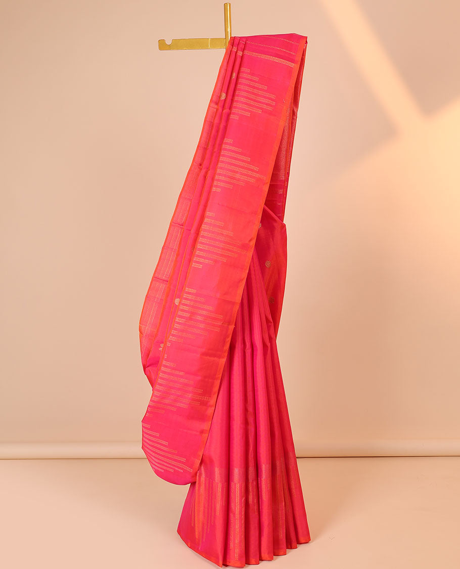 Pink silk saree with mayil chakram buttas, zari border of temple designs & zari-rich pallu of zari stripes
