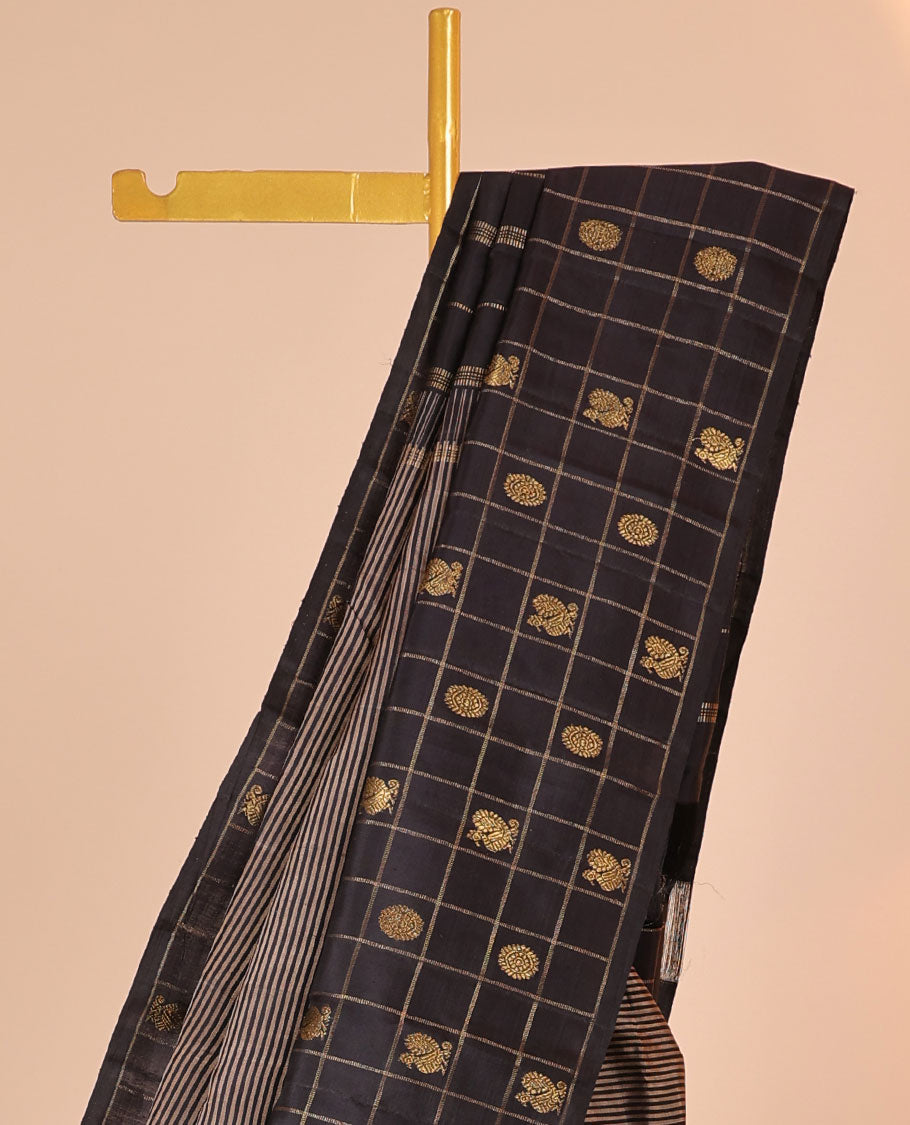 Black striped silk saree, zari checked border of mayil chakram & zari-rich pallu of seppu rekku