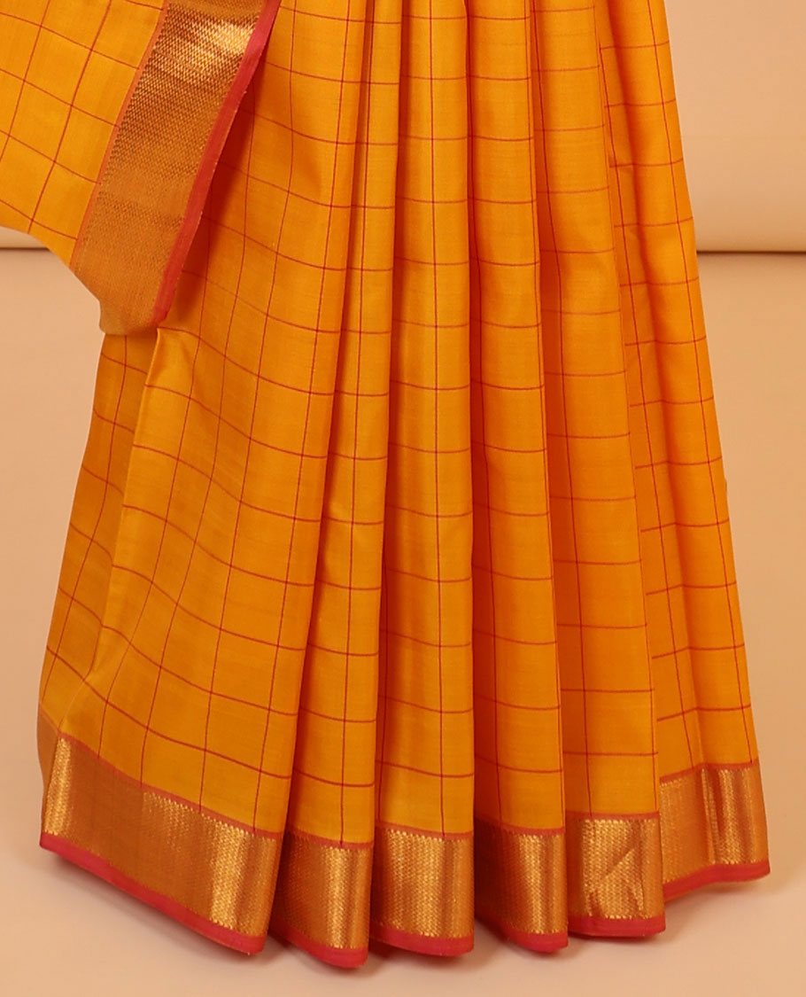 Orange checked silk saree, contrast zari border of muthu & vanki designs & pallu of zari designs