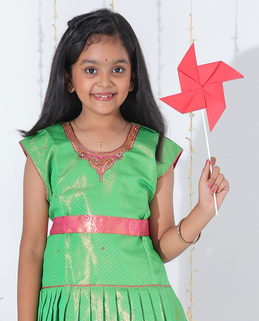 Pink jacquard readymade art silk pavadai with traditional zari design border & contrast embroidery sleeveless blouse