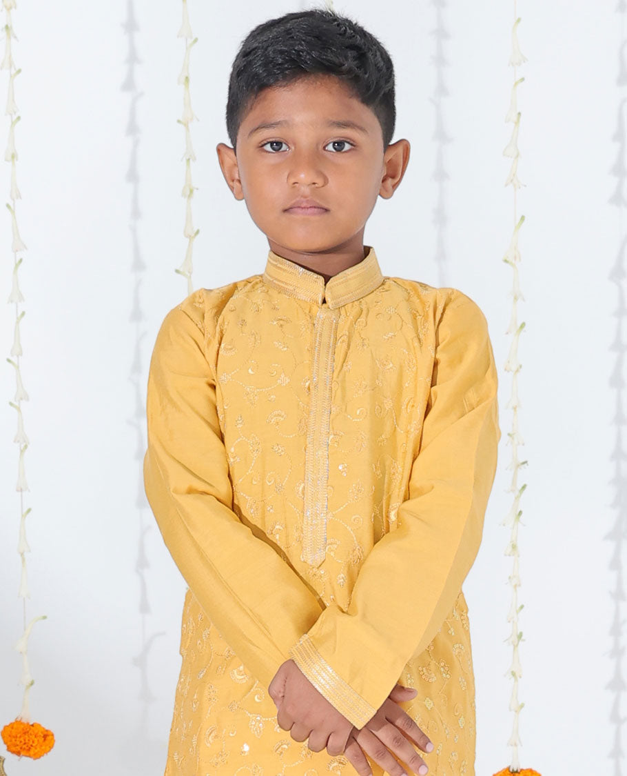 Mustard yellow cotton kurta set features floral vine embroidered full-sleeve kurta & contrast pants