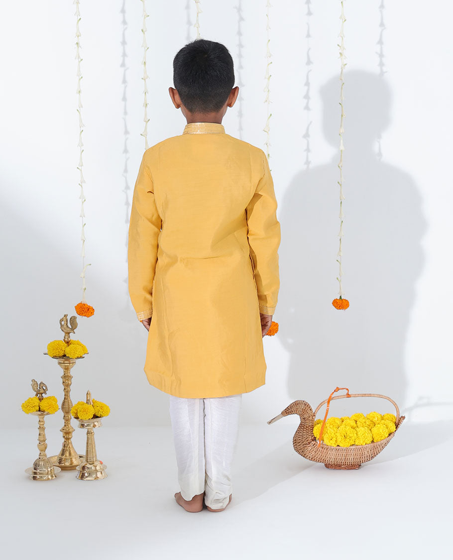 Mustard yellow cotton kurta set features floral vine embroidered full-sleeve kurta & contrast pants