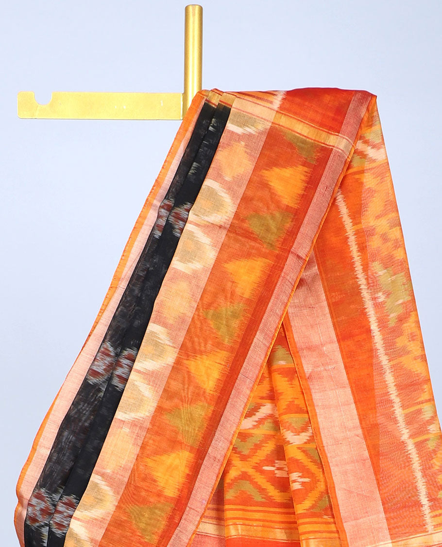 Black ikkat floral motifs silk cotton saree, contrast peacock & geometric border & pallu of ikkat argyle designs