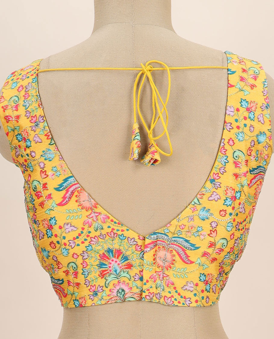 Yellow intricate floral printed with thread embroidered front and back leaf-neck sleeveless readymade blouse