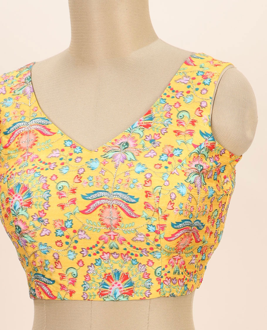 Yellow intricate floral printed with thread embroidered front and back leaf-neck sleeveless readymade blouse