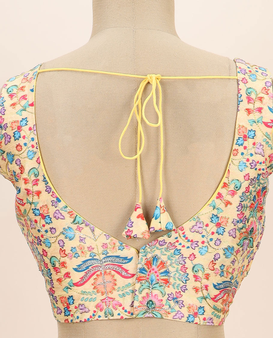 Pale yellow intricate floral printed with thread embroidered front and back leaf-neck sleeveless readymade blouse