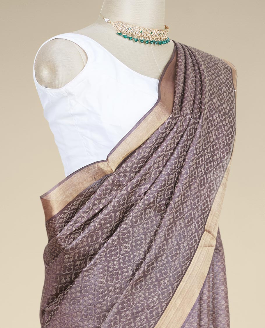 Brown spare intricate ogee patterned tusser silk saree with plain border