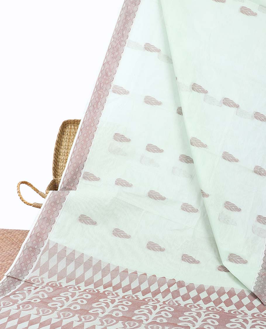 Pale green coimbatore cotton saree with buttas, self-border & pallu of floral & geometric designs