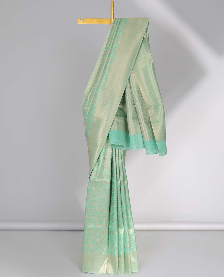 Green geometric softy saree, geometric design border & pallu of intricate designs