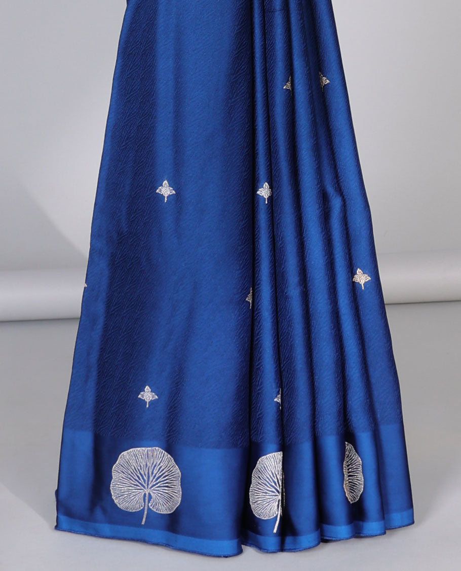 Blue mushru silk saree with buttas, floral design border & pallu of ogee pattern