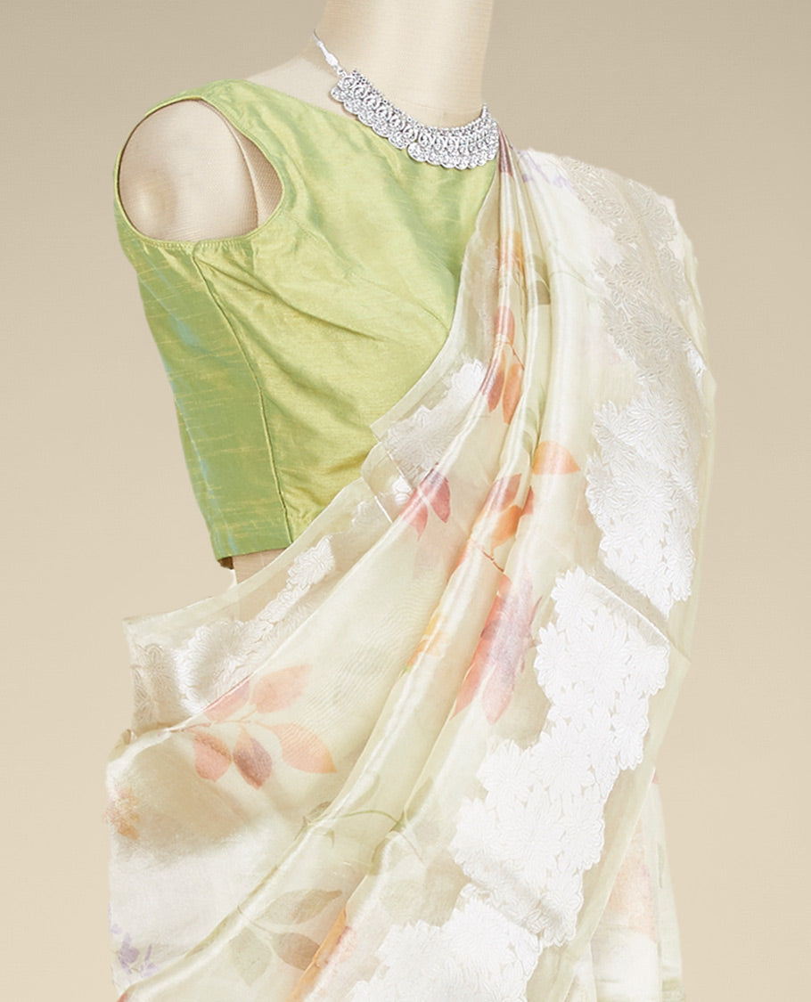 Green colorful floral printed tissue silk saree, zari border steeped with floral designs