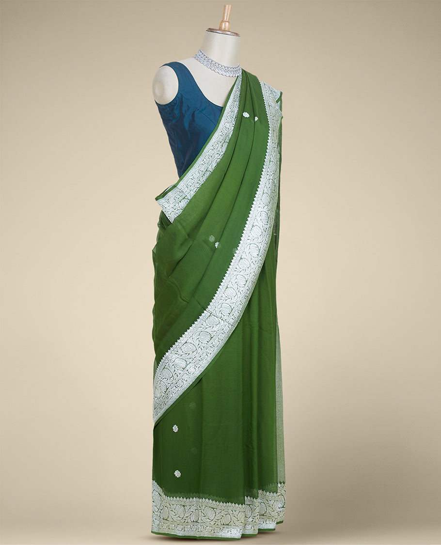 Green banaras georgette saree with buttas, traditional border of floral creeper designs