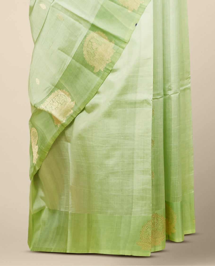 Green banaras raw mango silk saree with zari buttas, contrast border of intricate floral designs