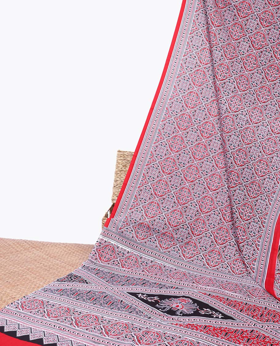 Red ajrakh printed mul-mul cotton saree, geometric printed border & intricately printed pallu