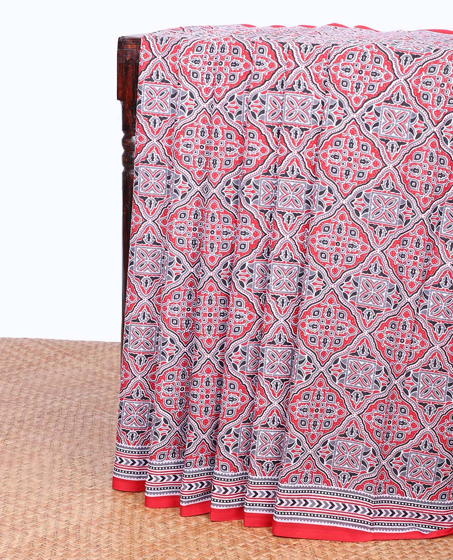 Red ajrakh printed mul-mul cotton saree, geometric printed border & intricately printed pallu
