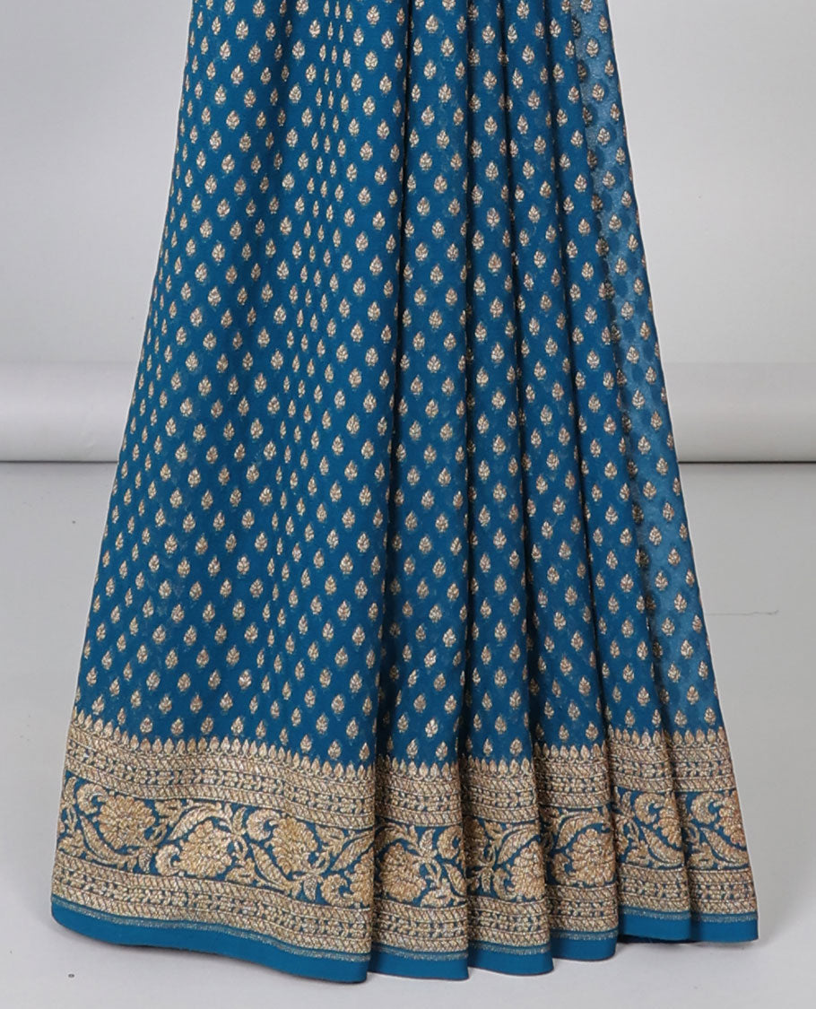 Blue khaddi georgette saree with buttas, floral jaal pallu & traditional border of floral creeper design