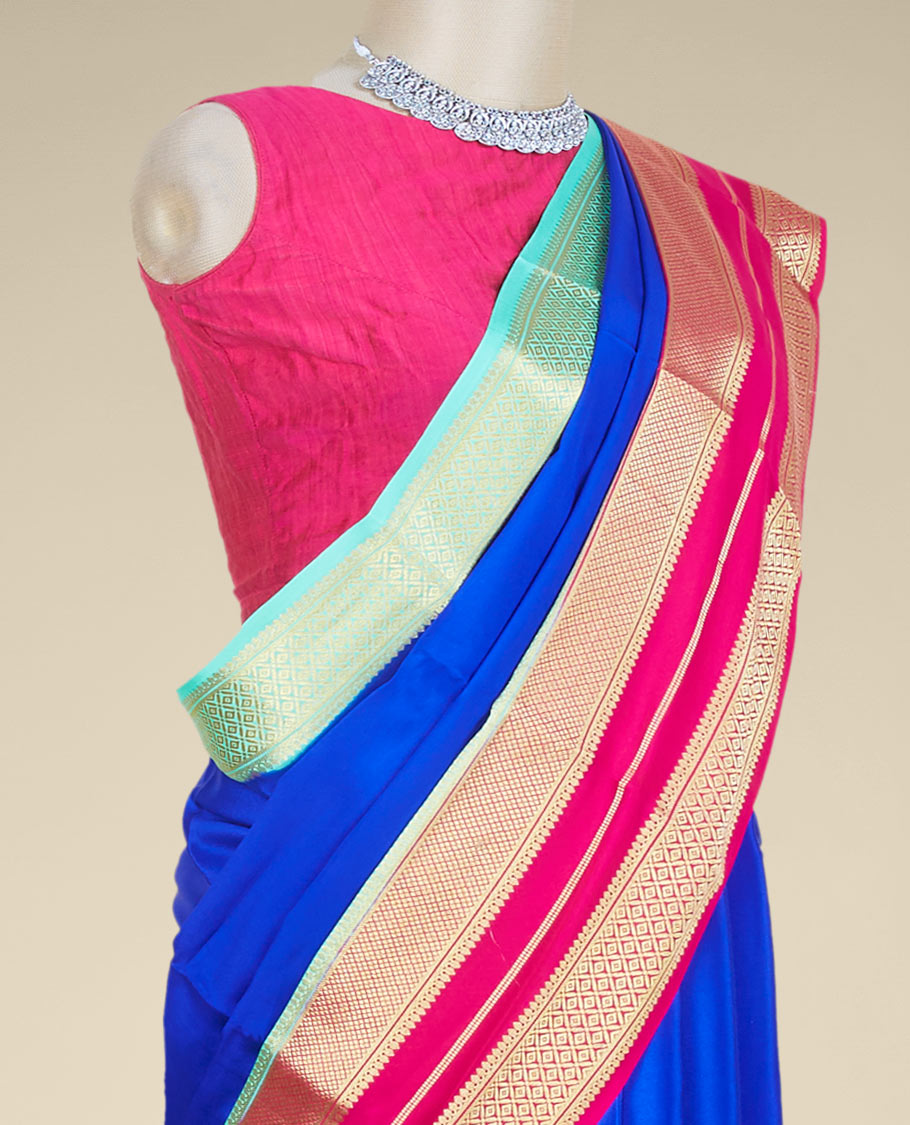 Blue plain mysore silk saree, contrast dual-colored big border steeped with traditional zari designs