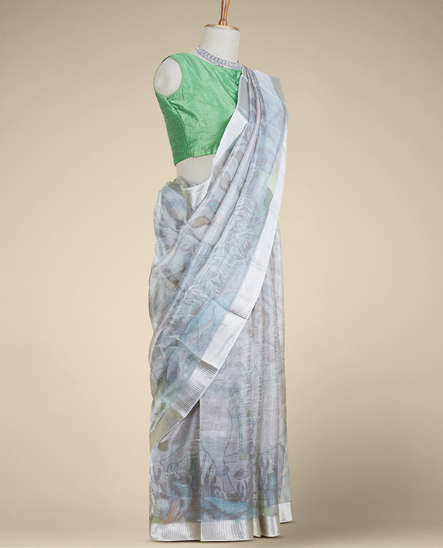 Blue floral vine & pichwai cow printed semi-banaras tissue silk saree, zari border