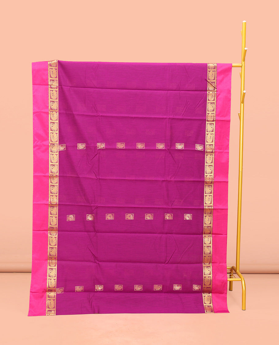 Rani Pink Semi-Silk Cotton Saree, Woven with Zari Buttas All Over Its Body, Complemented by a Contrast Kal Eragina Border of Peacock Designs, Pallu Steeped with Elephant Zari Motifs, and Paired with a Matching Blouse