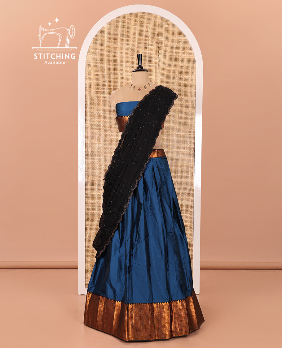 Blue Taffeta Silk Half-Saree Featuring a Plain Skirt, Complemented by a Contrast Traditional Zari Design Border, Paired with a Matching Blouse, and a Georgette Scallop-Bordered Stone Work Dhavani