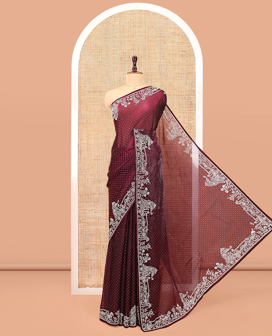 Wine Designer Saree, Scintillated with Stone Struck All Over Its Body, Highlighted by Intricate Stone Work Border, and Paired with a Matching Blouse