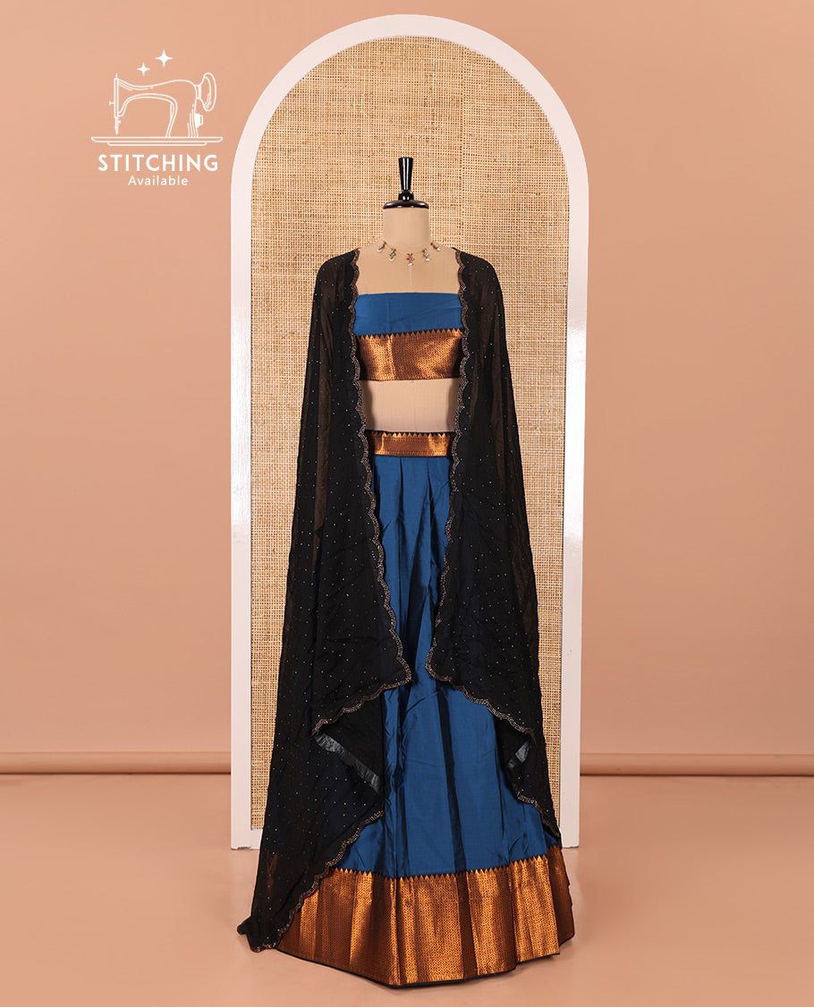Blue Taffeta Silk Half-Saree Featuring a Plain Skirt, Complemented by a Contrast Traditional Zari Design Border, Paired with a Matching Blouse, and a Georgette Scallop-Bordered Stone Work Dhavani