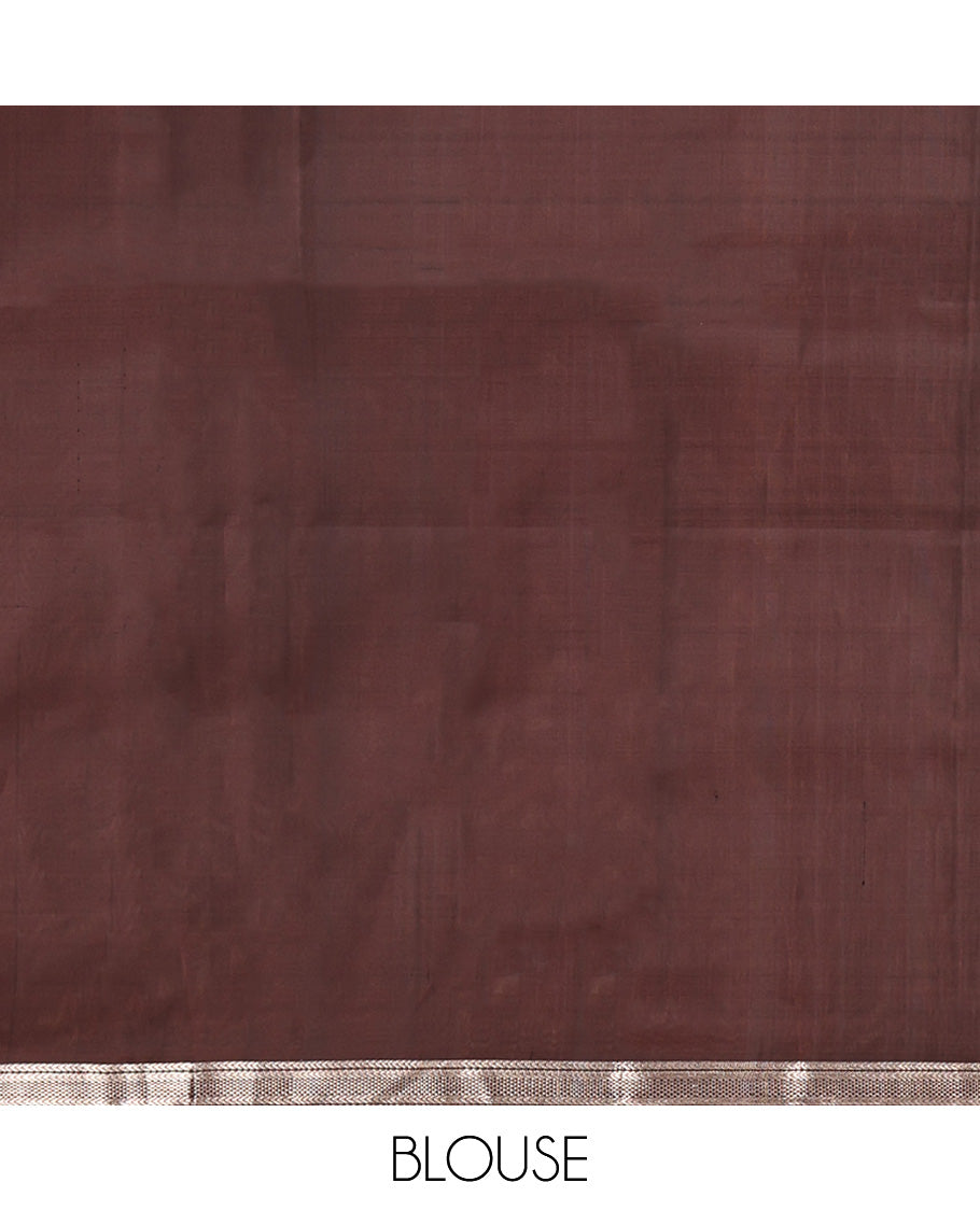 Brown Mayuri Soft Silk Saree, Spotlighted with Zari Buttas All Over Its Body, Highlighted by Piping Zari Border, Intricately Designed Pallu and Paired with a Matching Blouse