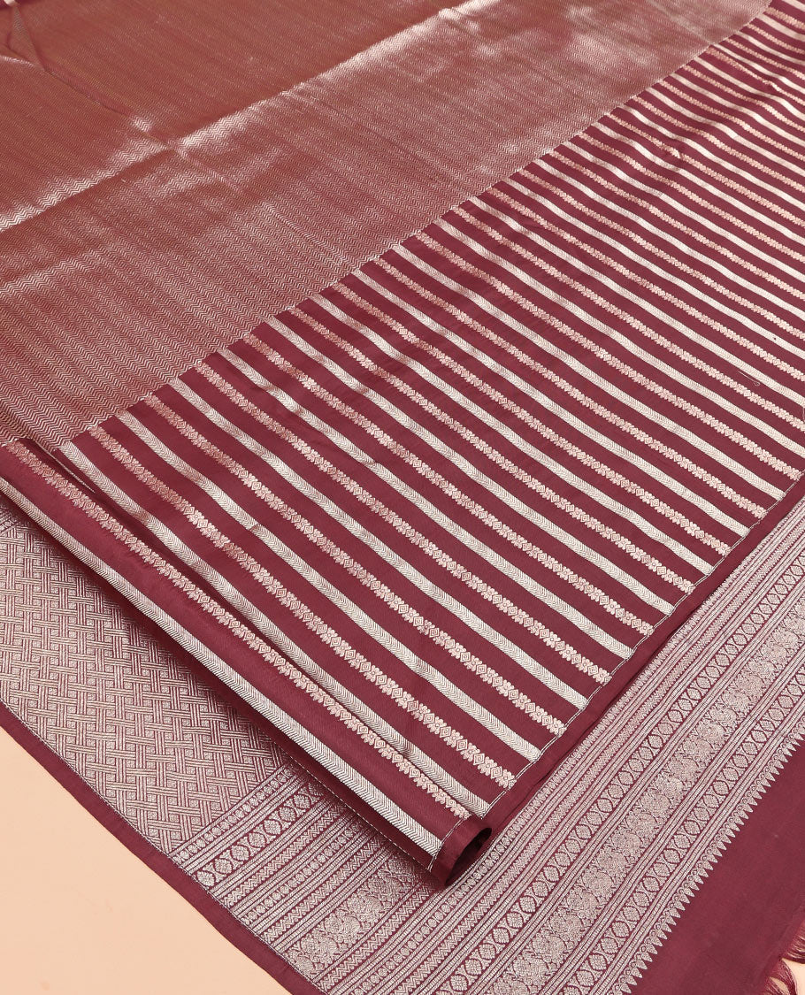Borderless Brown Vasundhara Silk Saree, Detailed with Vanki and Zari Stripes, Highlighted by a Grand Pallu, and Matching Blouse