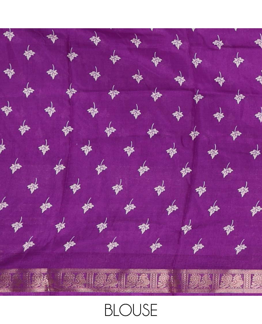 White leaf printed dola silksaree,contrast gold zari border of traditional motifs, geometric printed pallu & printed violet blouse