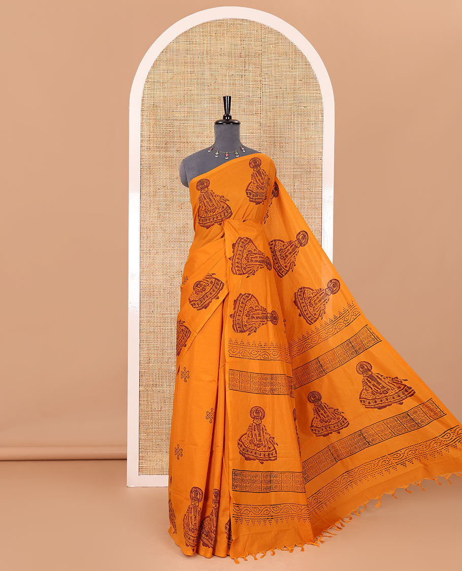 Borderless yellow kolam and kathakali motifs printed South cotton saree with a matching blouse, and a contrast floral vine printed blouse