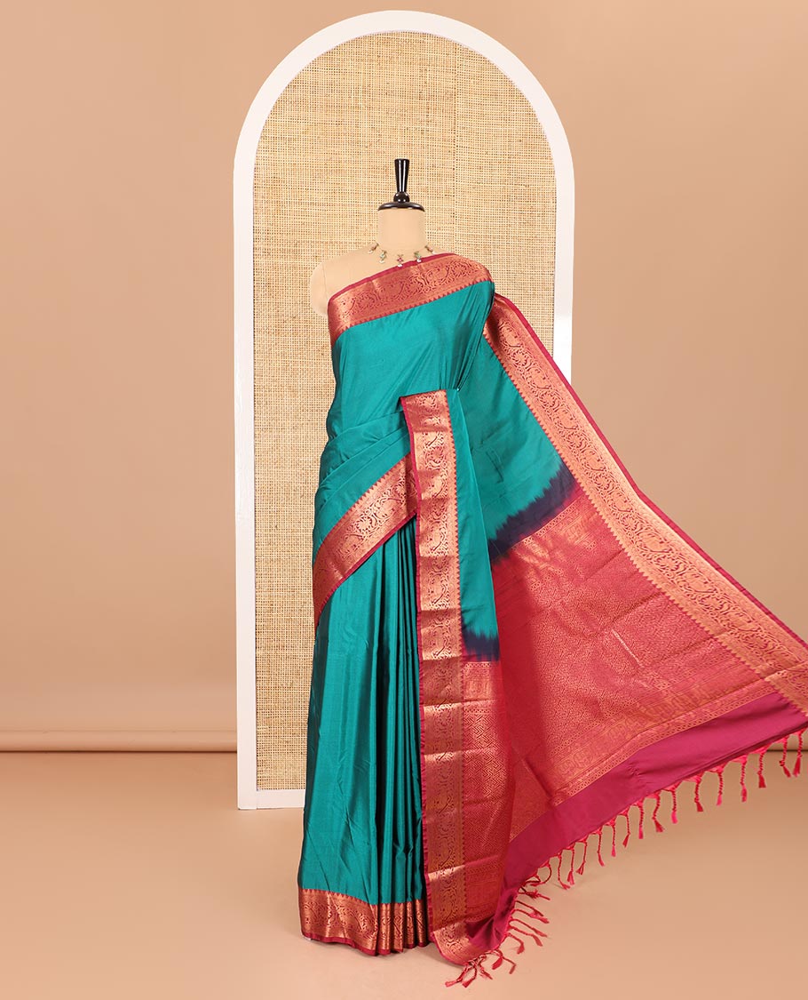 Peacock green plain luxury soft silk saree, contrast traditional temple zari border of elephant motifs, geometric zari pallu, and a contrast jacquard blouse