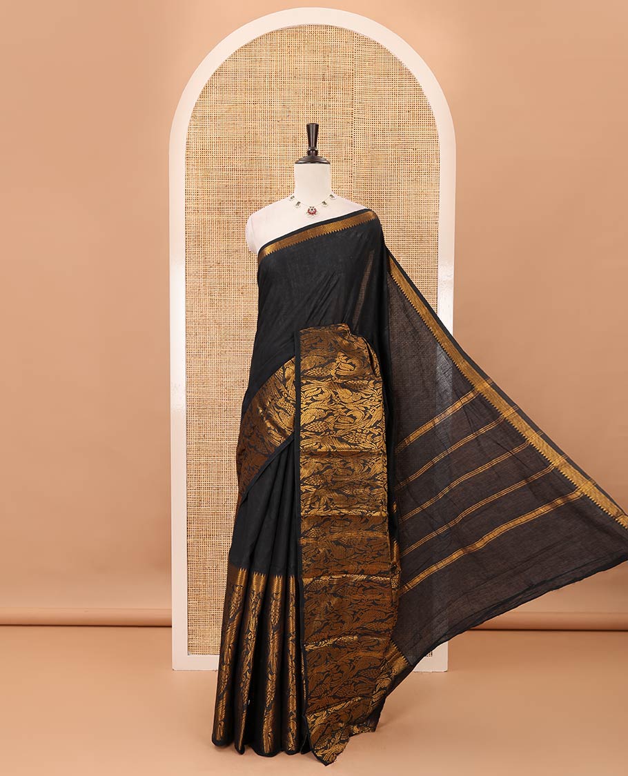 Dark green plain sungudi cotton saree, temple border of floral & bird zari designs, zari striped pallu & contrast orange jacquard blouse